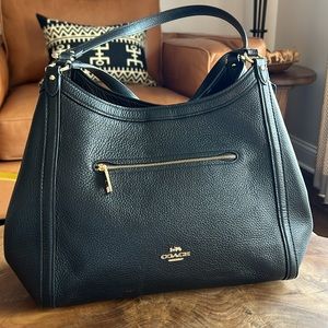 Large leather Coach shoulder bag in black.